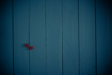 Many colorful little hearts wooden background