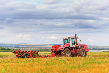 Naklejka premium Tractor on field