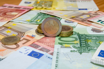 euro banknote with coins