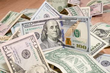 different US Dollar and Euro bills on table