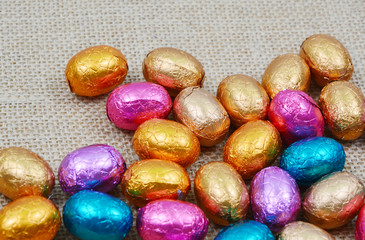 colorful egg chocolate on sack background