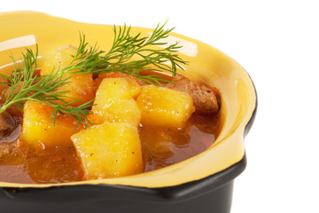 Stewed potatoes with meat and sprig of dill