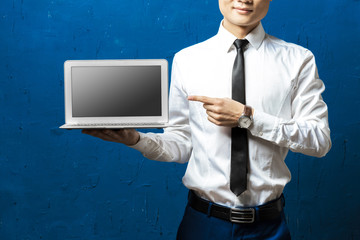 Businessman holding laptop