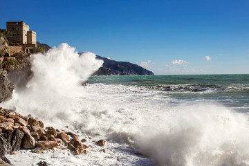 seascape from Monterosso al mare with big wave crashing on the c