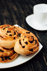 Homemade bakery with chocolate on dark wooden table.