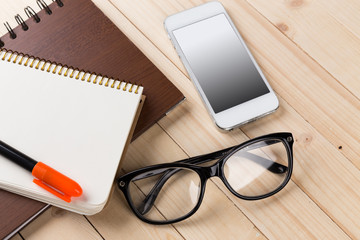 Composition with glasses and books on the table
