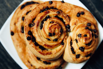 Homemade bakery with chocolate on dark wooden table.