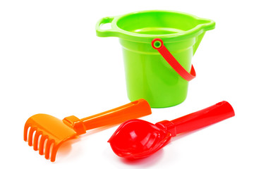 Children's toys  bucket  shovel and  rake on the white