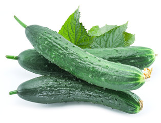 Cucumbers with leaves on the white background.