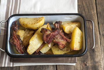 Grilled pork ribs with baked potatoes