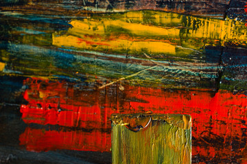 Abstract painted canvas. Oil paints on a palette.