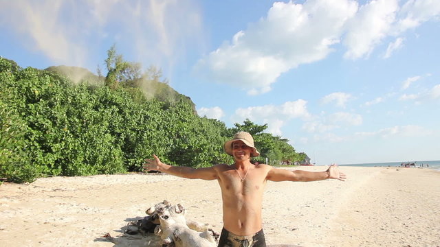 Man Throwing Up Sand on The Beach