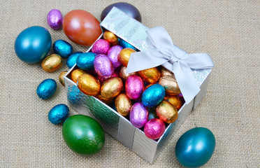 colorful egg and chocolate in gift box 
