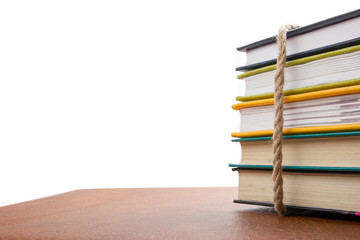 A stack of colorful books, open book.