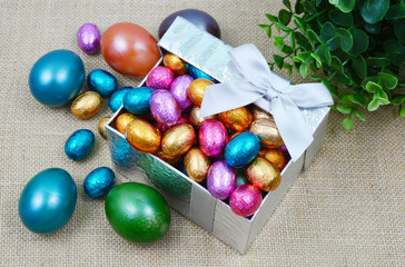 colorful egg and chocolate in gift box 
