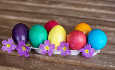 Obraz na płótnie Canvas vibrant Easter Eggs on a wooden background
