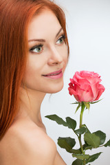red-haired woman with a rose