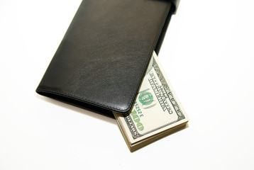 Black wallet with banknotes of US dollars inside