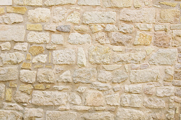 Old beige stone wall background texture - 102509844
