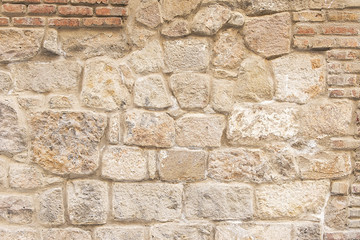 Old beige stone wall background texture