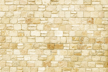 Old beige stone wall background texture