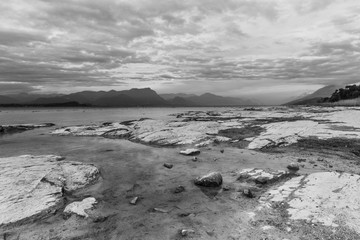 scenic lake landscape at sunset in black and white. Long exposure