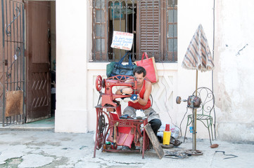 Shoemaker in the street at Havana