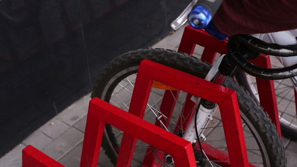 Human hands secured to the bike lock
