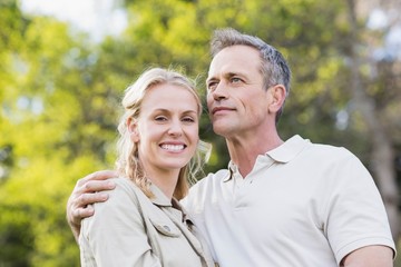 Cute couple with arms around each other