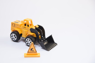 Yellow toy car on a white background