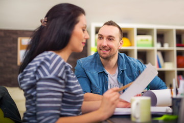 Two designers working together in creative office