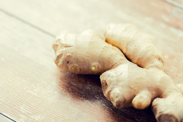 Fototapeta premium close up of ginger root on wooden table