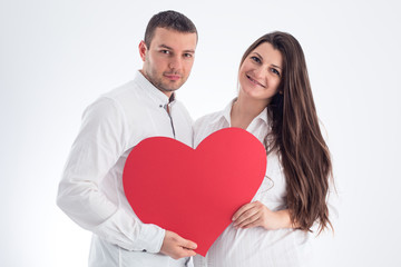 Happy family. Pregnant woman and her husband isolated on white