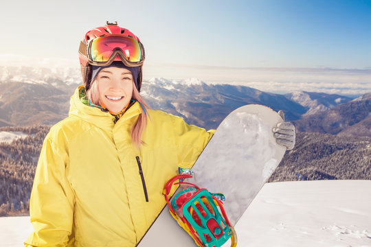 Snowboarder girl on the background of high mountain Alps, Switzerland