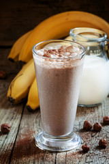 Fresh smoothie banana and chocolate, milk and nuts in a large gl