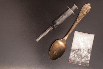 syringe, spoon and drugs