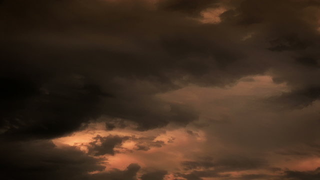 Fantastic Clouds 0201: Time lapse golden clouds travel across a sunsetting sky.