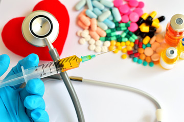 Heart, syringe, drugs and stethoscope, Heart healthy concept