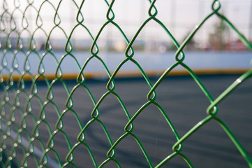 Fototapeta premium Stadium behind focused fence