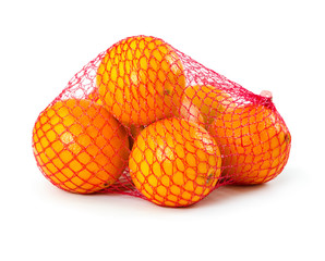 Fresh oranges in plastic mesh sack