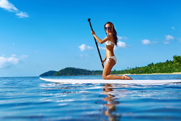 Recreational Water Sports. Healthy Happy Fit Woman With Sexy Body Paddling, Kneeling On Stand Up...
