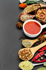 Spices on black background.