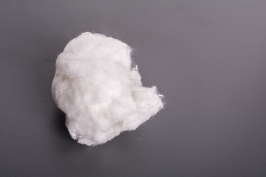 Cotton White Ball Against A Dark Background