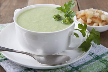 Cream of broccoli with croutons and parsley