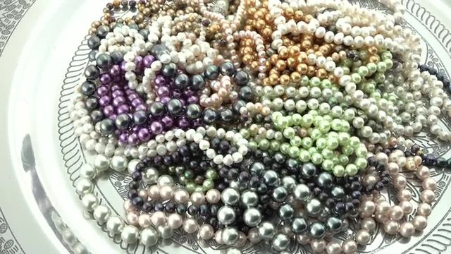 Pile of pearl jewelry turning slowly