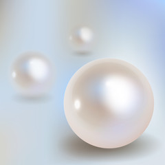 3 Pearls vector with shadow on a light blue bokeh fog background.