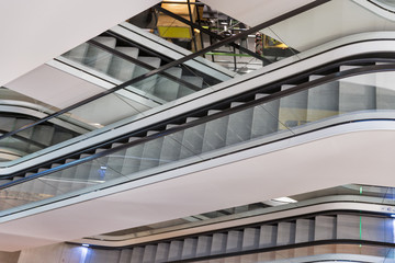 Fototapeta premium Escalator in modern shopping mall