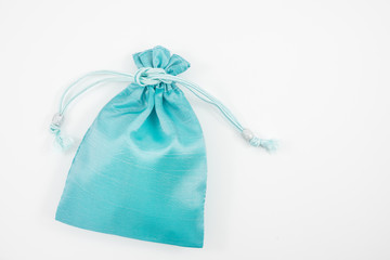 The turquoise blue silk mini gift pouch bag to hold jewelry.