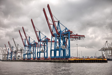 Hamburg port. Shipping vessels on a cloudy day.