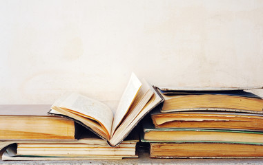 Very dirty discarded books, one book opened